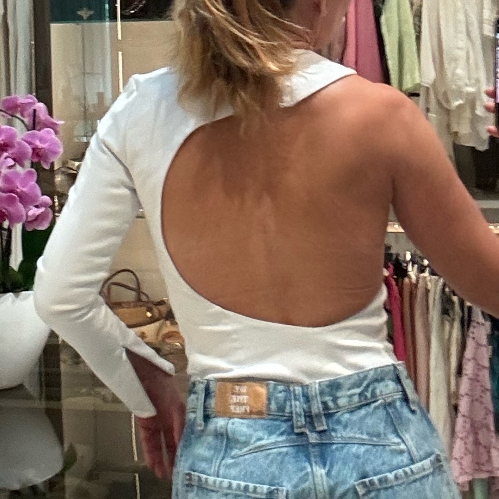 Zara White asymetrical open back bodysuit.